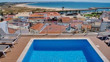 Outdoor pool, open 8:00 AM to 11:00 PM, sun loungers