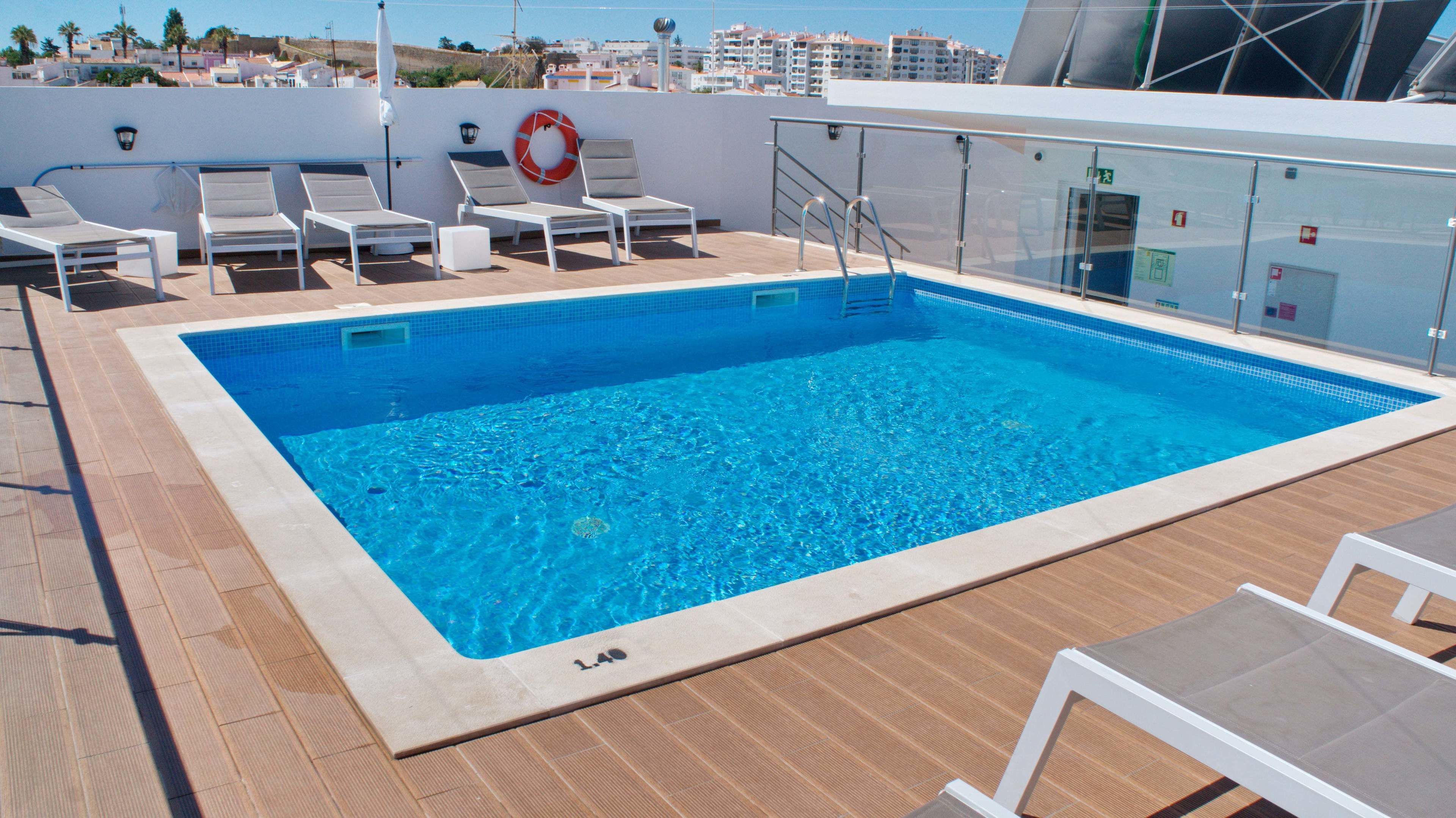 Outdoor pool, open 8:00 AM to 11:00 PM, sun loungers