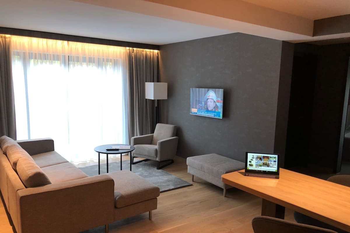 Suite, 1 King Bed | Living area | Flat-screen TV