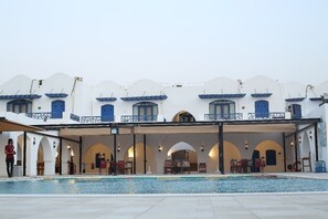 2 outdoor pools, open 10:00 AM to 5:30 PM, free cabanas, pool umbrellas