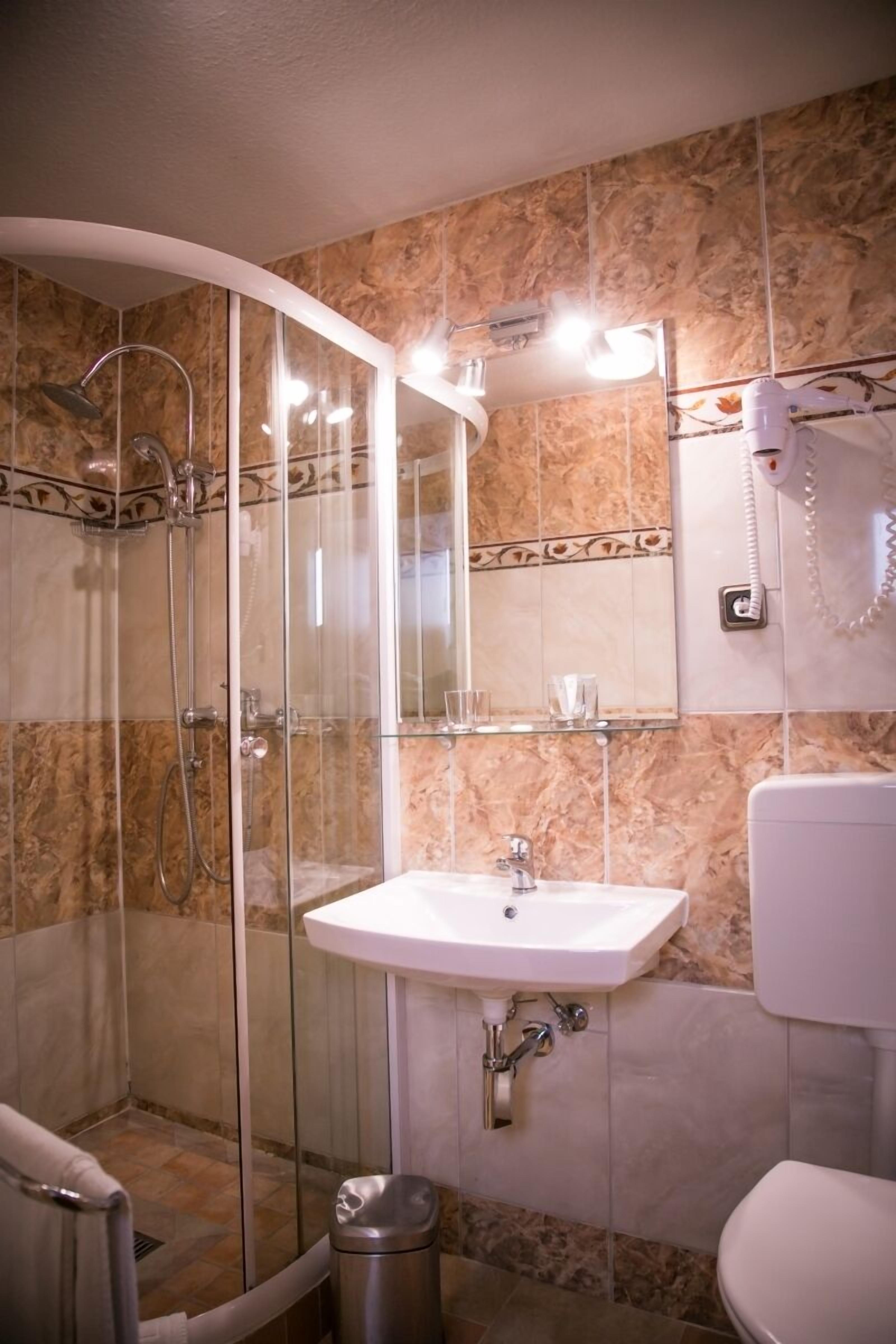 double room, non smoking, city view | bathroom | shower, slippers, towels