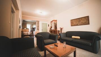 Deluxe Apartment, 2 Bedrooms | Living area | Flat-screen TV