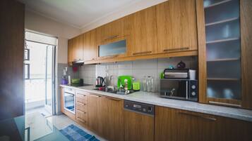 Deluxe Apartment, 2 Bedrooms | Private kitchen | Full-size fridge, microwave, oven, stovetop