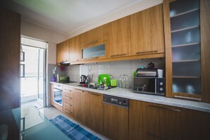 Deluxe Apartment, 2 Bedrooms | Private kitchen | Full-size fridge, microwave, oven, stovetop - Apartment on Nikaias 5 (Patras)