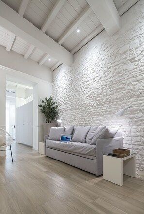 Deluxe Apartment, Balcony | Living room | Flat-screen TV