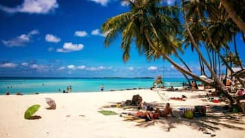 Beach nearby, white sand, beach towels