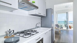 Apartment, 2 Bedrooms | Private kitchen | Full-size fridge, oven, stovetop, cookware/dishes/utensils