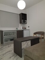Apartamento, 1 quarto | Área de estar | TV de tela plana