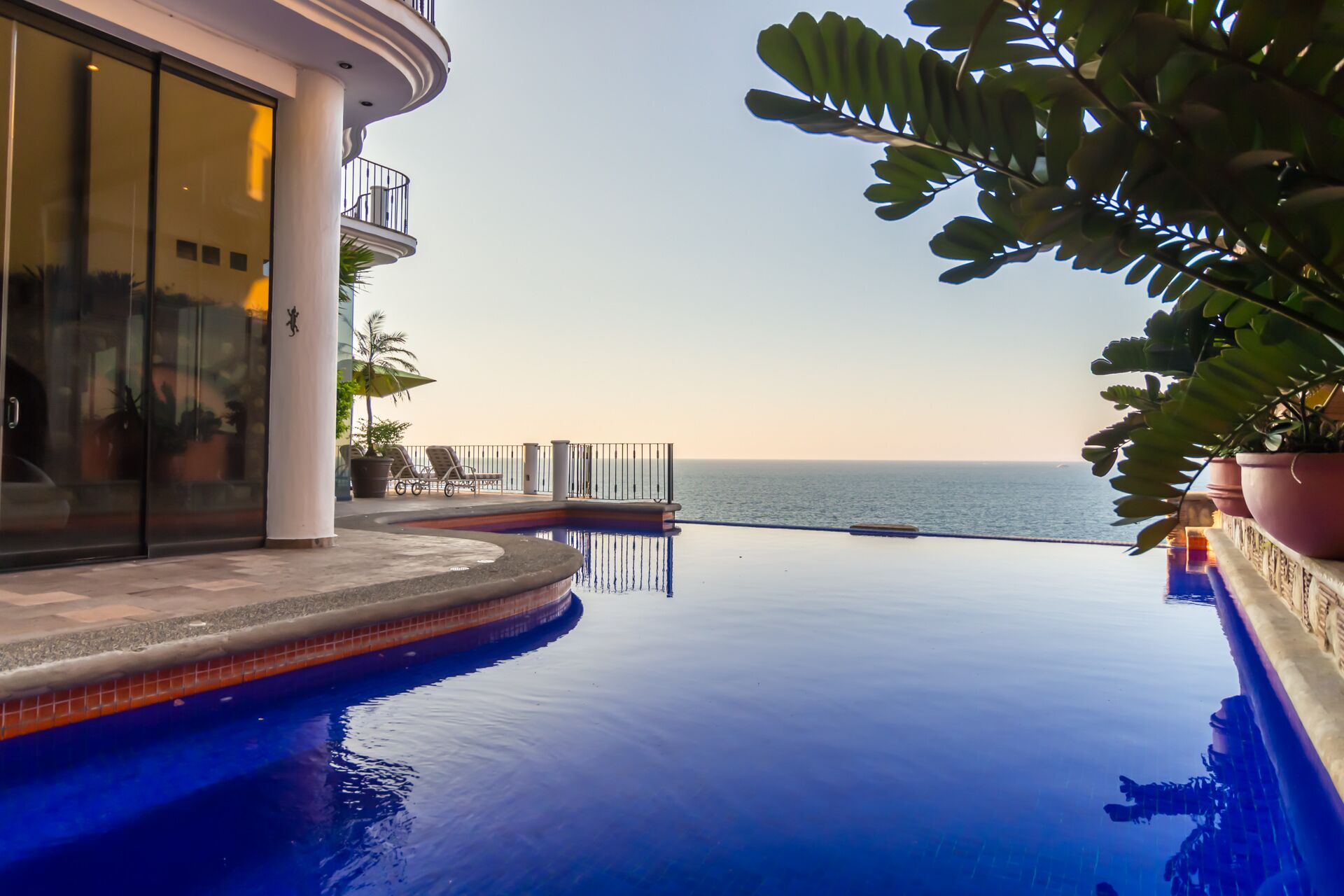 View from hot tub looking out of the pool and ocean.