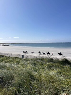 A beach with a group of people riding horses. - 9 Murlach Moorings Ballyconneely (Ballyconneely)