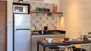 Fridge, microwave, stovetop, coffee/tea maker