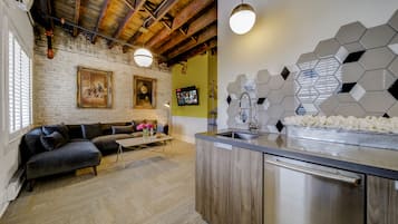 Can't Even Suite | Living area | 50-inch Smart TV with digital channels, Netflix, books