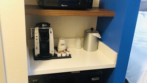 A compact kitchenette with a microwave, coffee maker, and a small refrigerator. - Holiday Inn Express & Suites Elko by IHG (Elko)