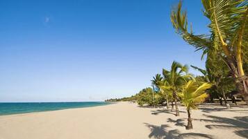 On the beach, sun loungers, beach towels