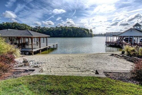 Lakefront retreat with views, hot tub, kid's play area, dock & fiber internet