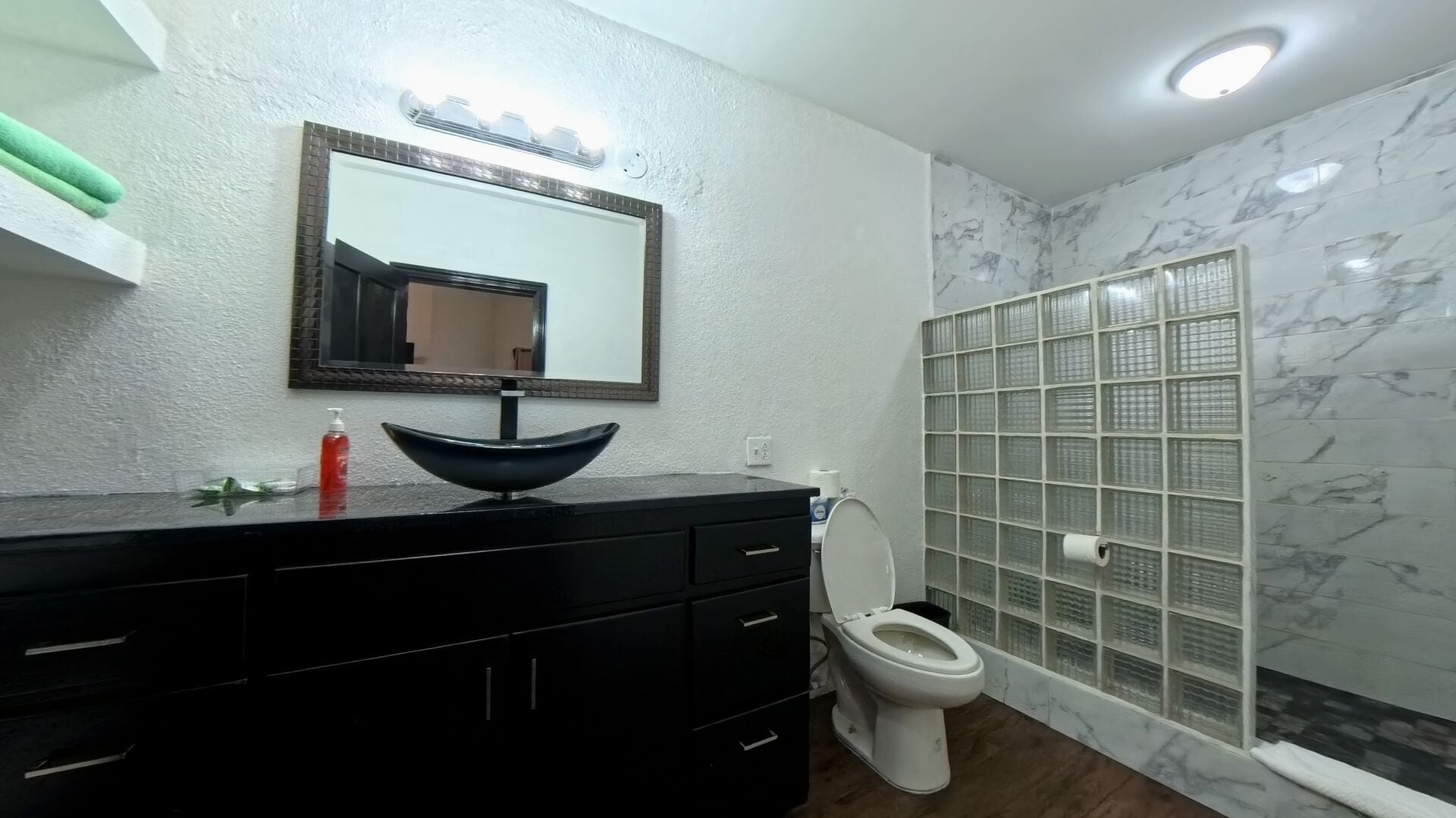 studio suite | bathroom | shower, free toiletries, hair dryer, soap