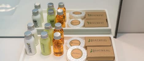 A display of various toiletries including bottles of lotion, soap, and other personal care items.