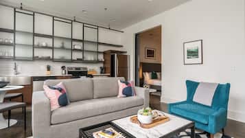 Deluxe Apartment, 1 King Bed with Sofa bed | Living room | Flat-screen TV