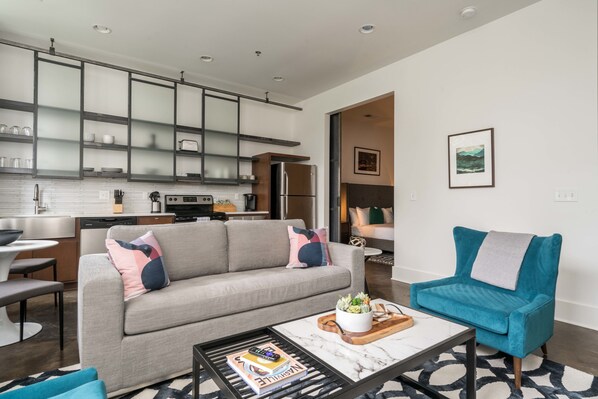 Deluxe Apartment, 1 King Bed with Sofa bed | Living room | Flat-screen TV