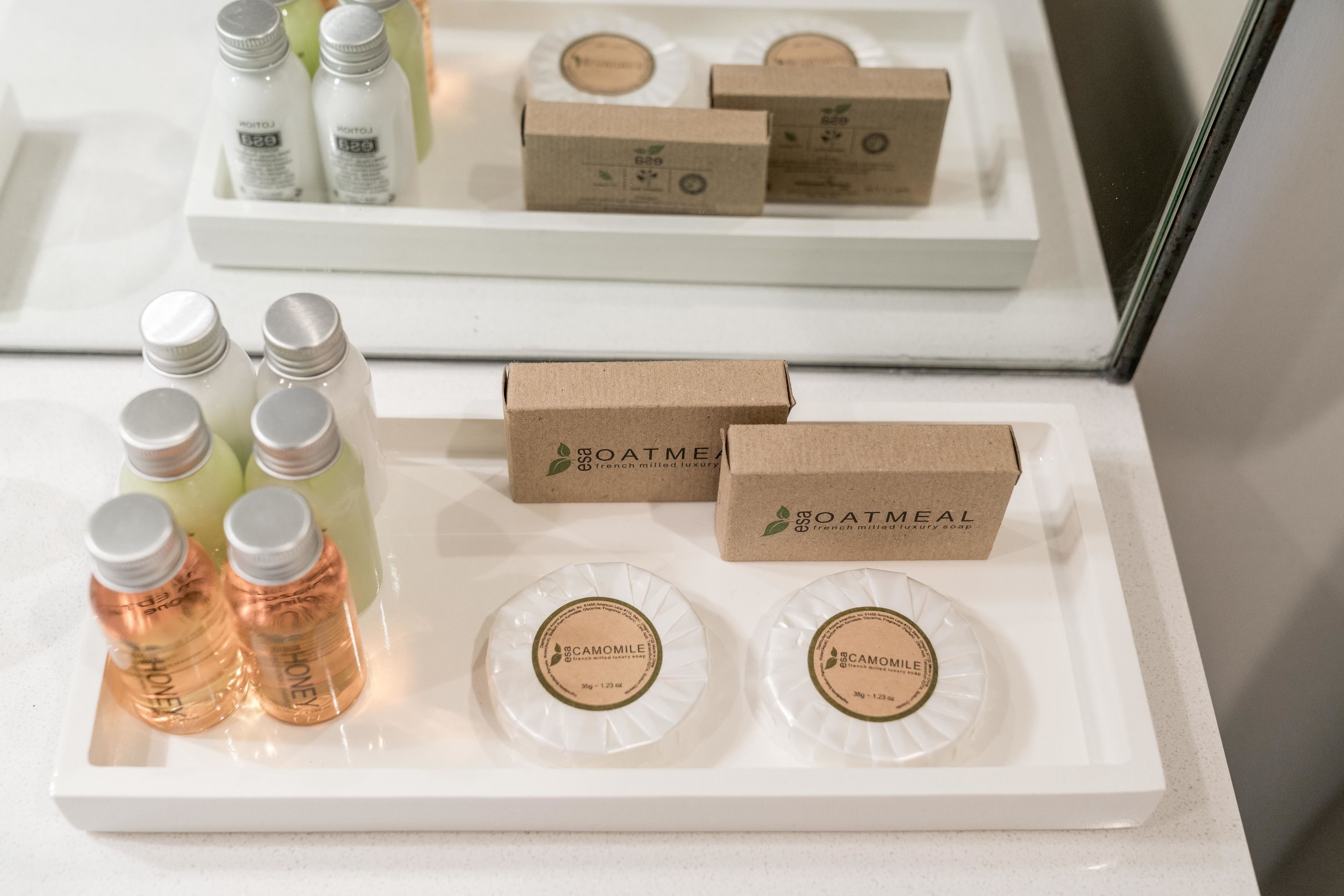 A display of toiletries and packaged goods on a white tray.