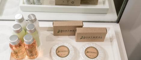 A display of toiletries and packaged goods on a white tray.