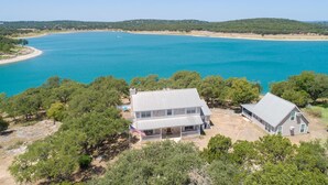 A coastal property with a large house, a smaller structure, and a swimming pool. - Endless Tranquility Cl1105h 3 Bedroom Home by RedAwning (Canyon Lake)
