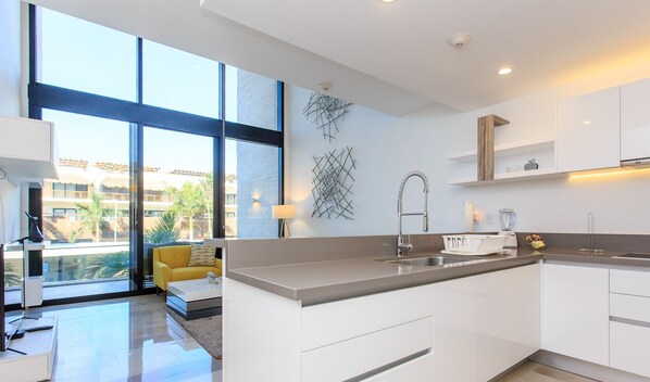 Full-size fridge, microwave, espresso maker, cookware/dishes/utensils