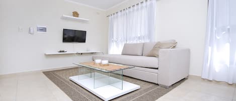 32-inch flat-screen TV with cable channels, LED TV