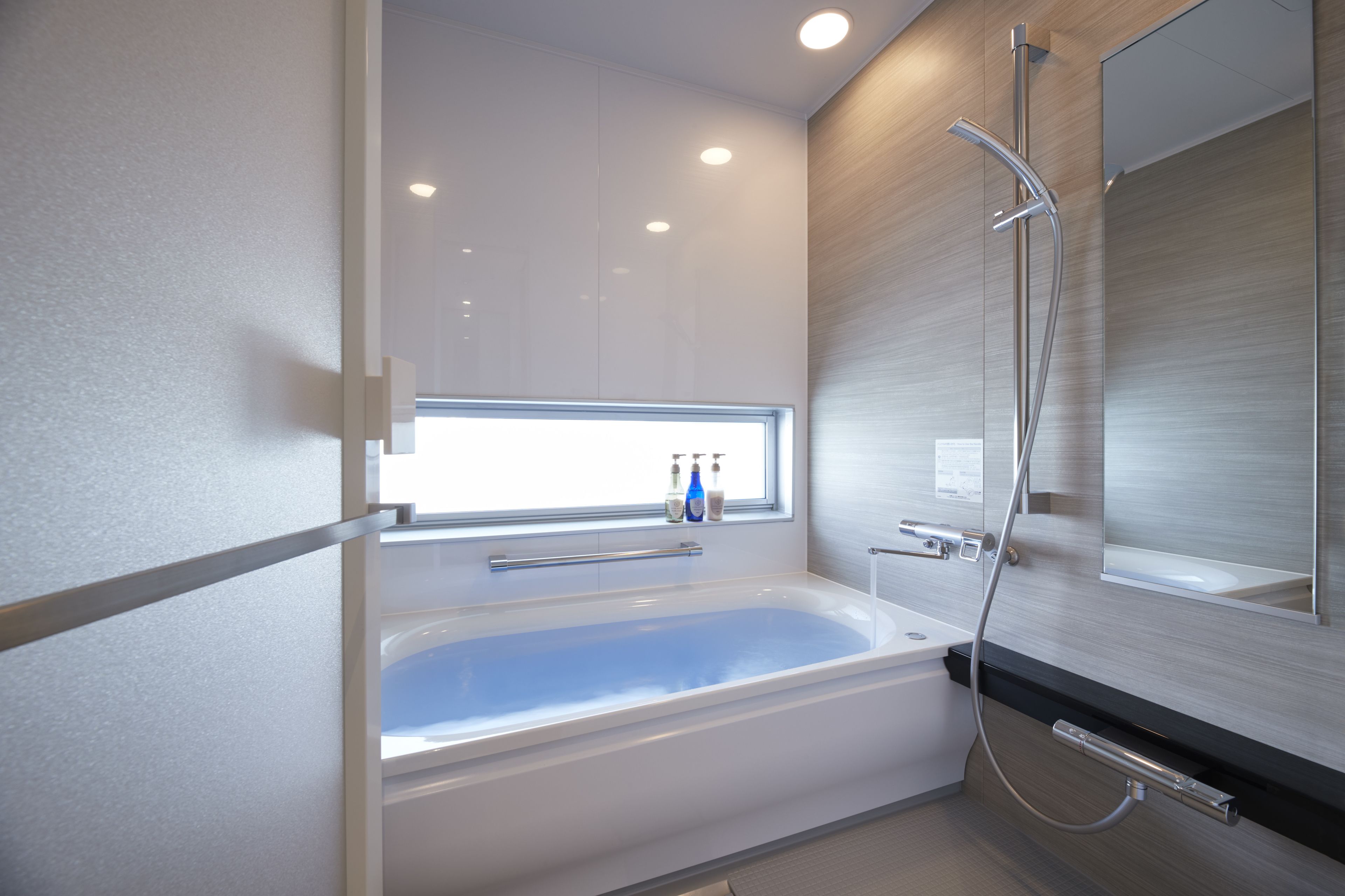 separate bathtub and shower, deep-soaking bathtub, hair dryer, slippers