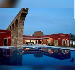 Outdoor pool, open 8:00 AM to 8:00 PM, pool umbrellas, sun loungers