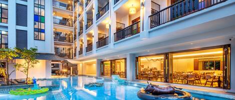 Outdoor pool, open 7:00 AM to 11:00 PM, pool loungers