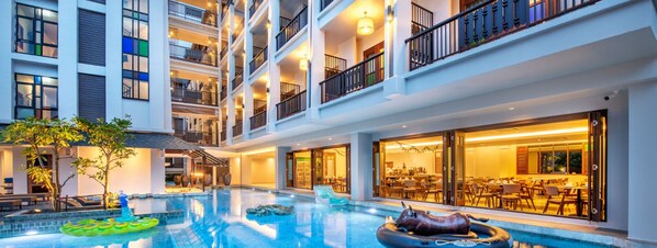 Outdoor pool, open 7:00 AM to 11:00 PM, pool loungers