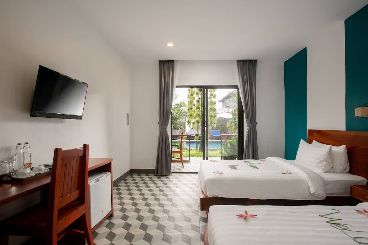 Deluxe suite | Lakens van Egyptisch katoen, luxe beddengoed, een minibar