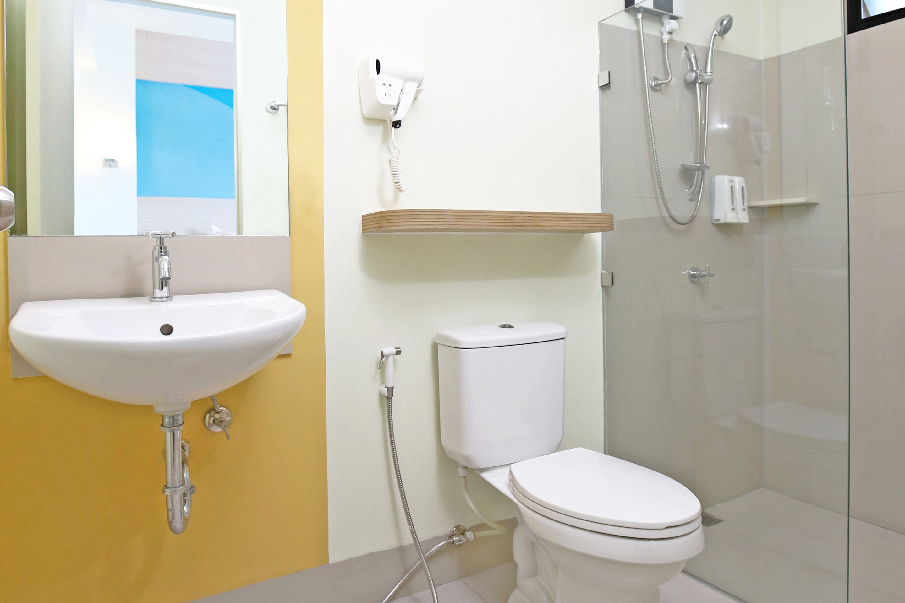 shower, hair dryer, bidet, towels