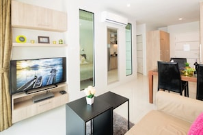 City Apartment, 1 Bedroom, Partial Ocean View | Living area | 32-inch flat-screen TV with cable channels, TV