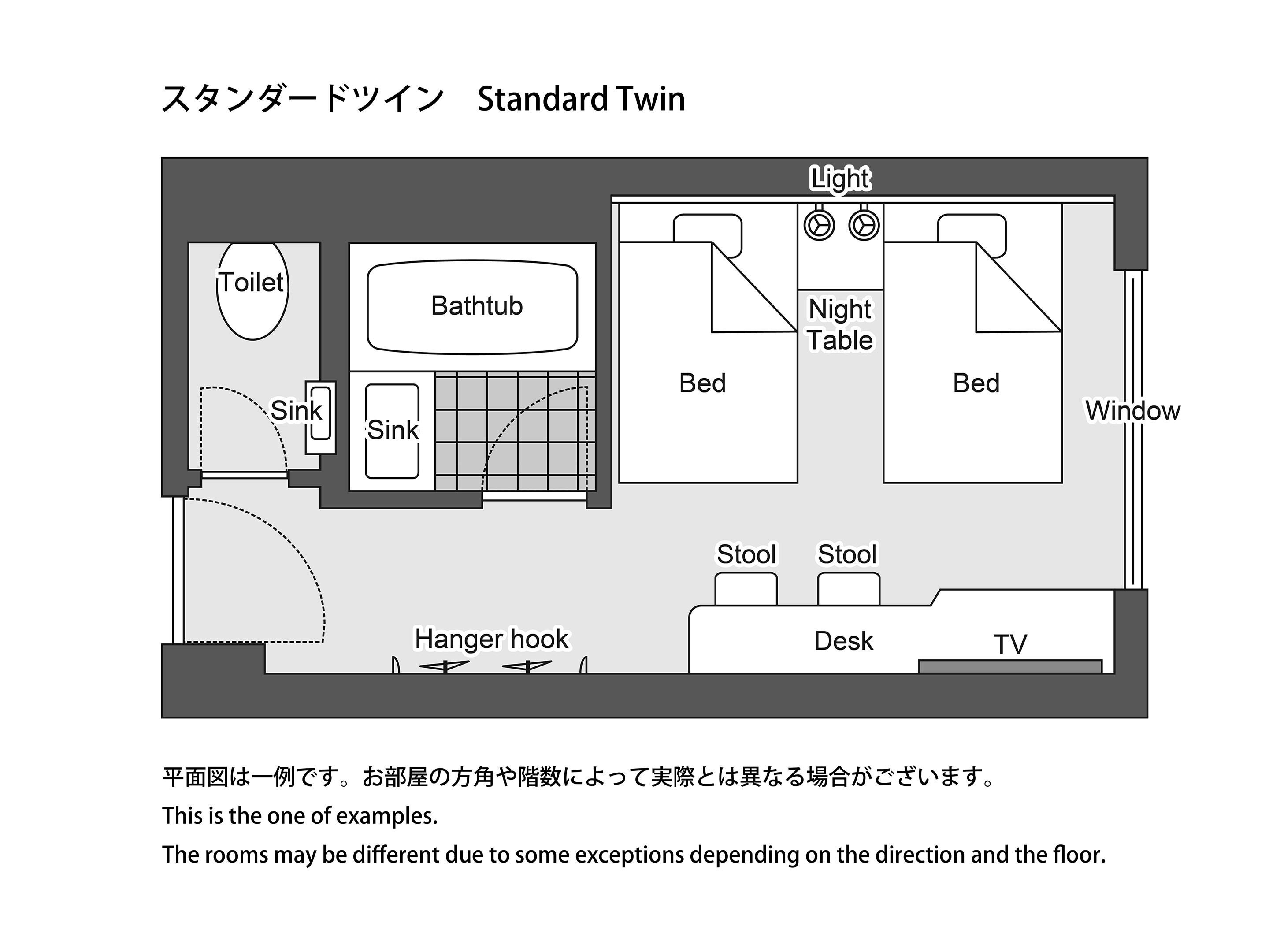 A standard twin room layout with a bathroom, two beds, a desk, TV, and a hanger hook.