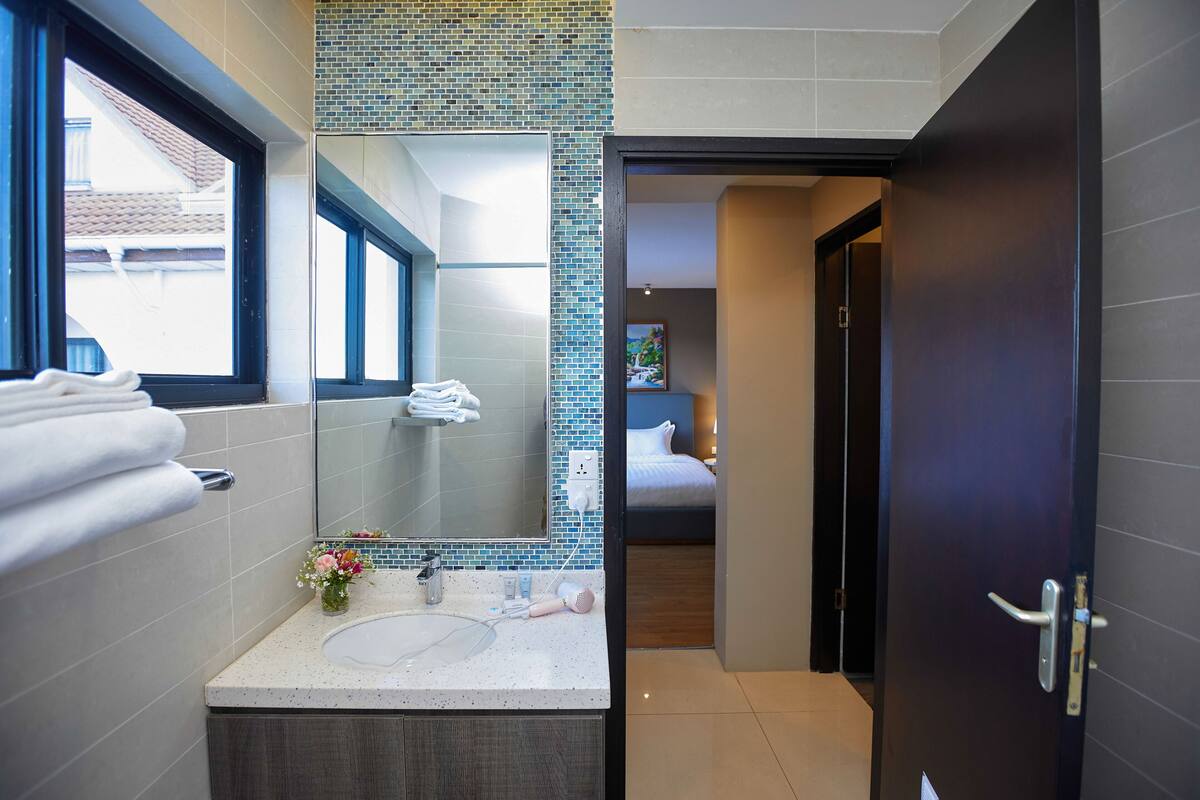 bathroom | hair dryer, towels, soap, shampoo