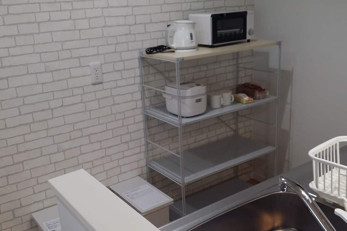 twin room | private kitchenette | full-sized fridge, microwave, stovetop, rice cooker