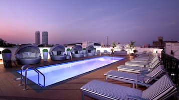 Outdoor pool, open 8:00 AM to 8:00 PM, pool loungers