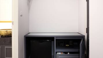 A compact kitchen with a built-in dishwasher, a microwave, and a small countertop.