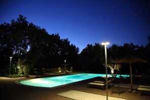 Seasonal outdoor pool, open 10:00 AM to 7:00 PM, pool umbrellas