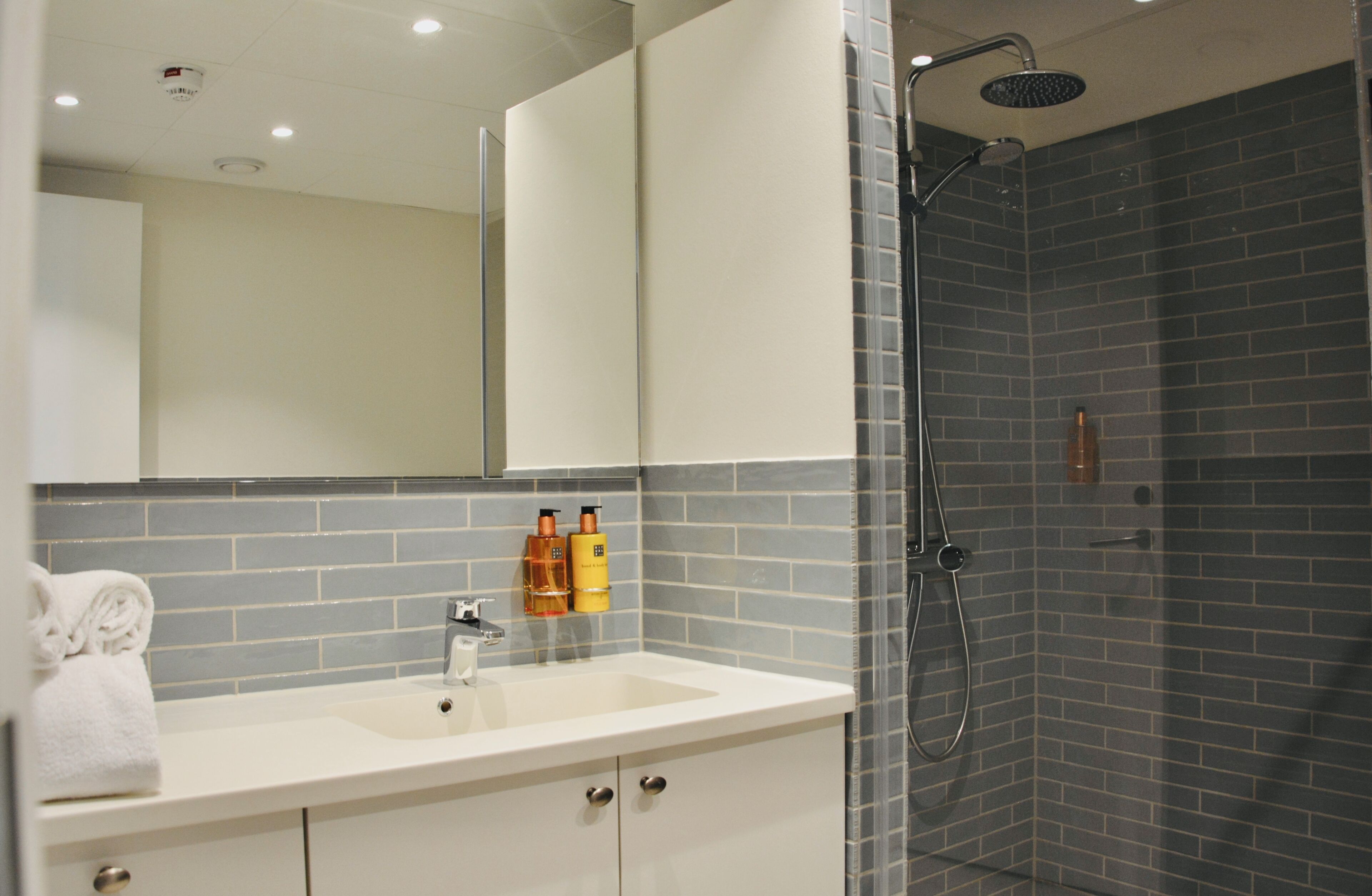 shower, hair dryer, heated floors, towels