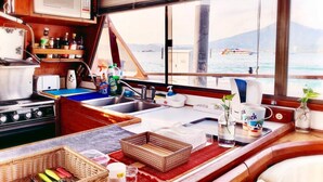 Lemonia Yacht | Private kitchen | Coffee/tea maker, full-size fridge, microwave, stovetop - My Home Story (Malacca City)