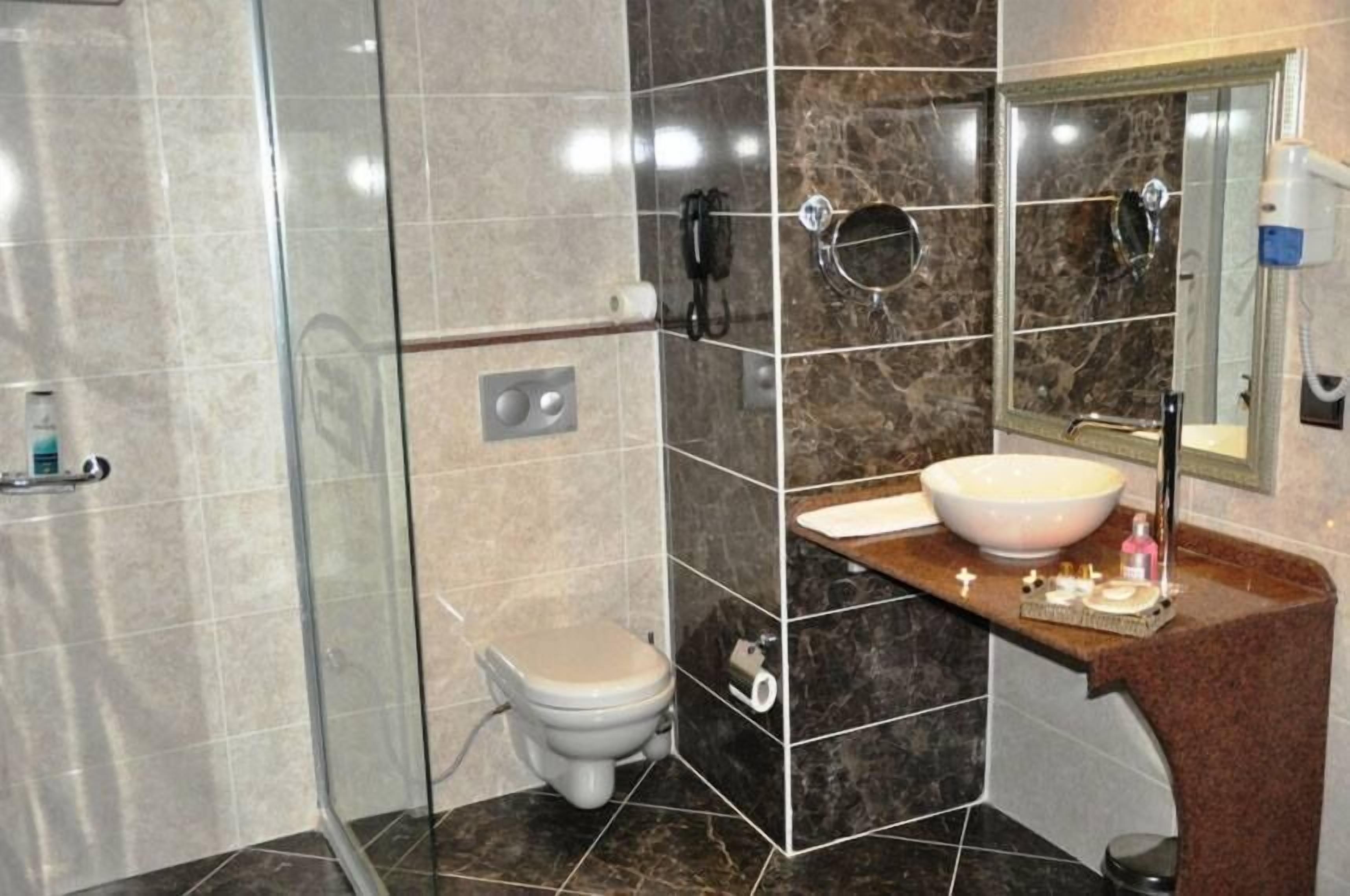 Shower, free toiletries, hair dryer, slippers