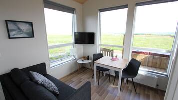 Cabin, 1 Bedroom | Living area | Flat-screen TV