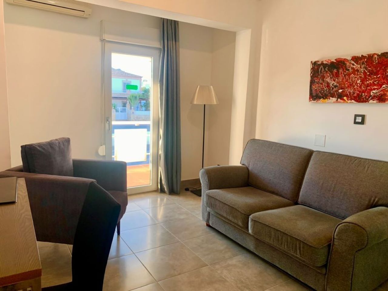 superior double room | living area | flat-screen tv