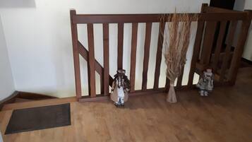 A wooden staircase with a wooden railing.