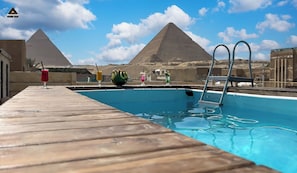 Outdoor pool, open 9:00 AM to 6:00 PM, lifeguards on site