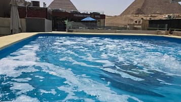Outdoor pool, open 9:00 AM to 6:00 PM, lifeguards on site