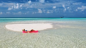 A beach with clear turquoise water and a white sand area. - Ocean Beach Inn - Maldives (Hangnaameedhoo)